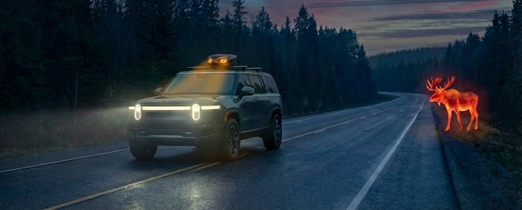 SUV driving at night with thermal moose